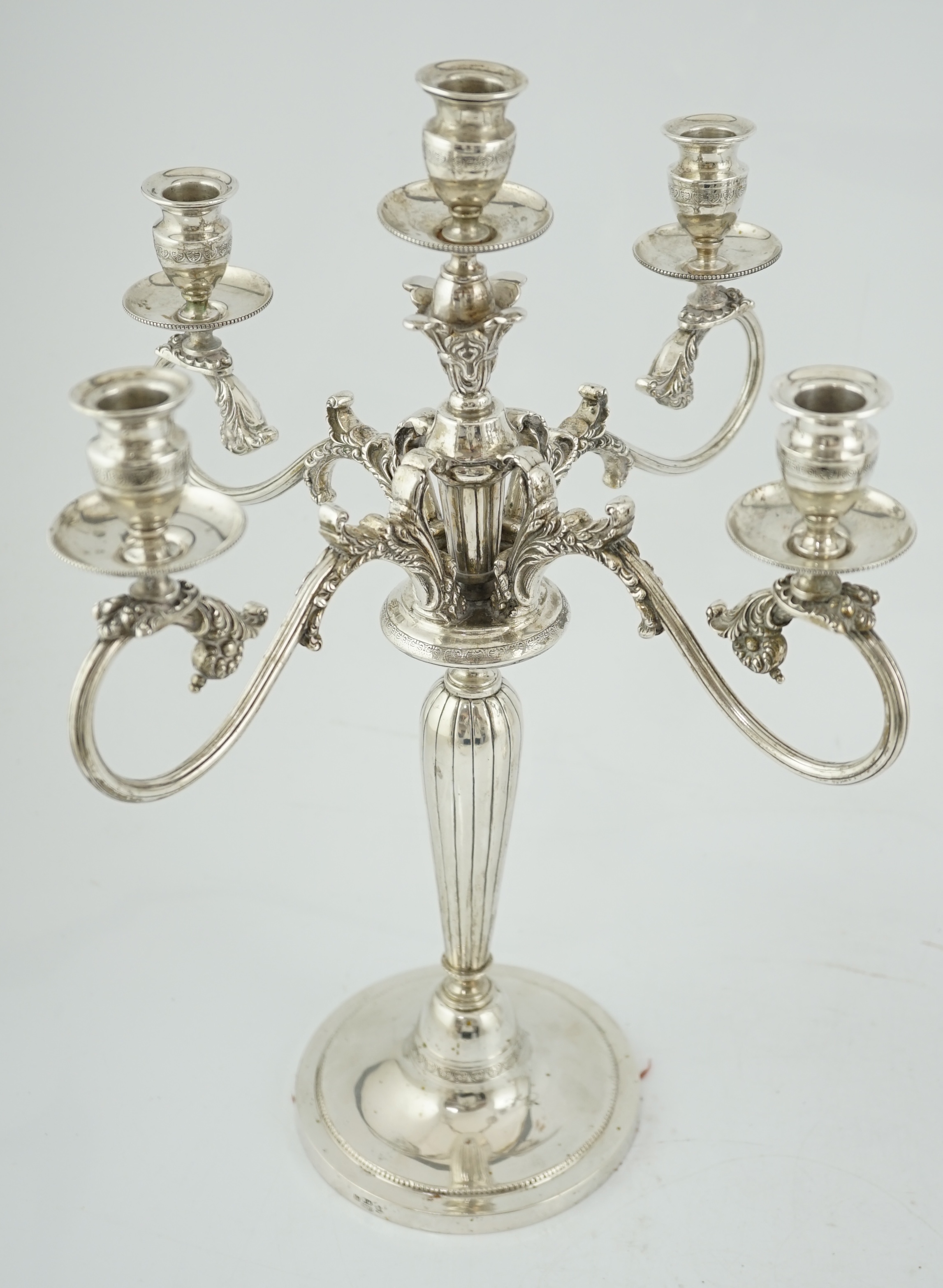 A pair of late 19th century Russian 84 zolotnik four branch, five light candelabra